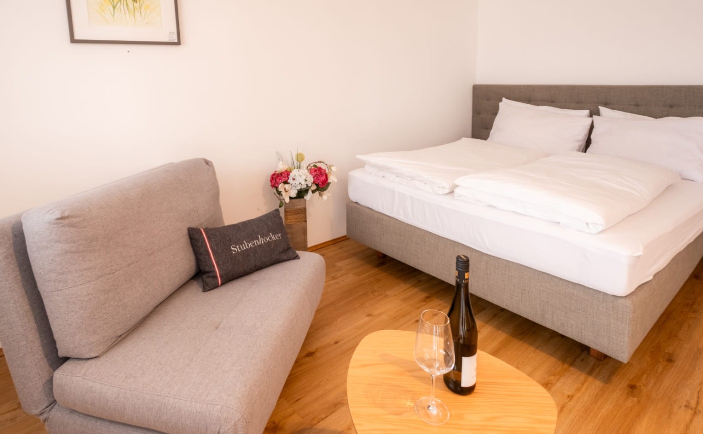 Modern apartment with double bed, seating area and living space